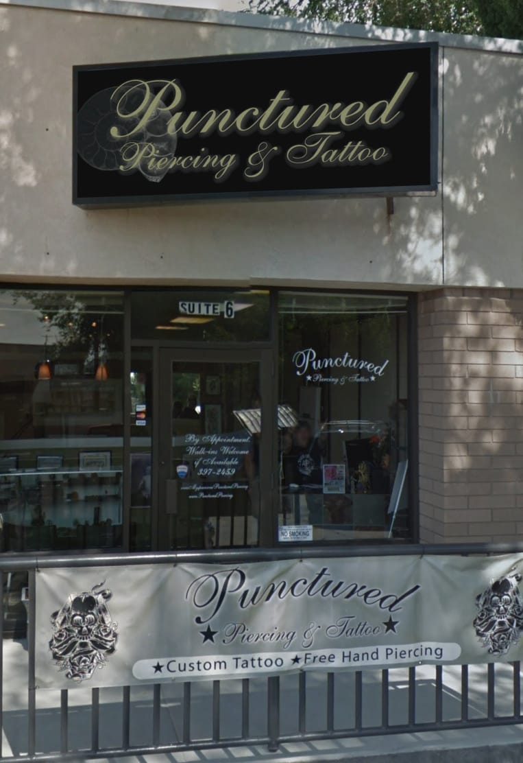 Shop exterior photo that shows the sign and the front door